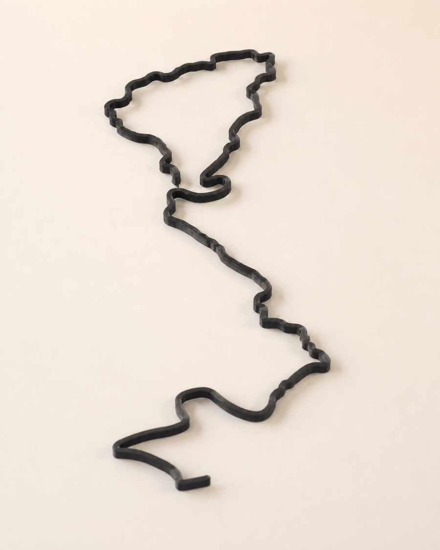Black 3D-printed GPS route on a warm neutral background