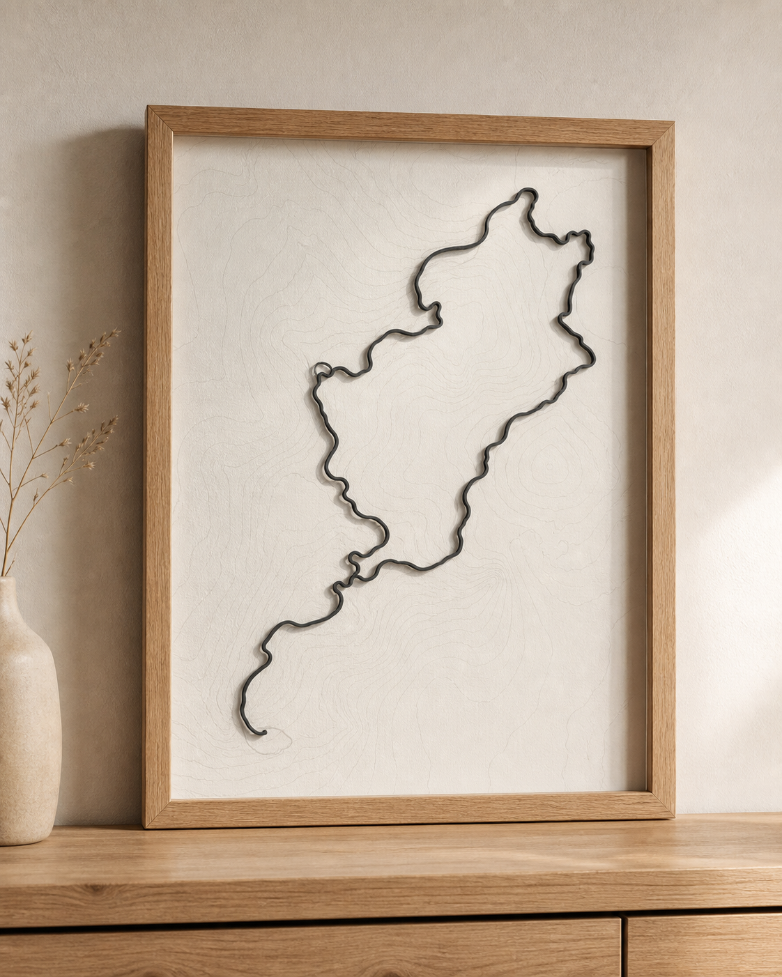 Custom route poster in an oak frame with a raised black 3D route